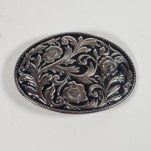 Silver Toned Over Blackened Background With Flowers and Vine Oval Belt Buckle